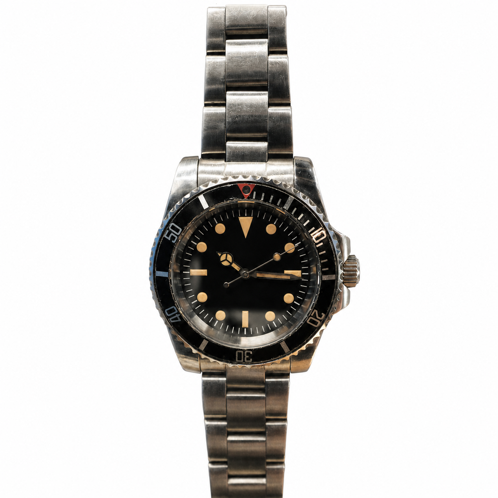 A vintage stainless steel wristwatch with a black dial, black bezel, and a silver-toned metal link bracelet, shown against a plain white background.