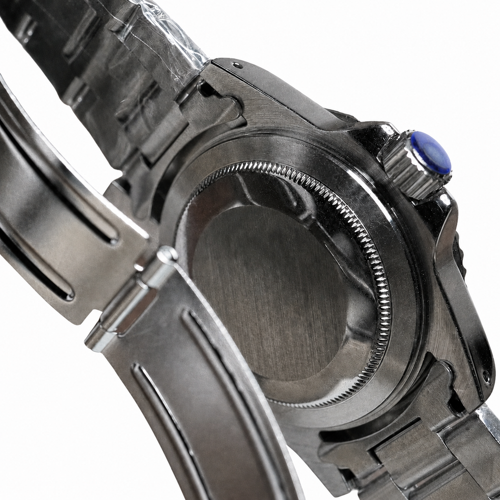 Solid caseback, screw-down crown and open folding clasp on the aged GMT watch
