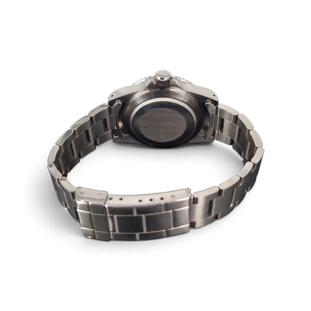 Rear angled view showing the stainless steel caseback, bracelet and folding clasp
