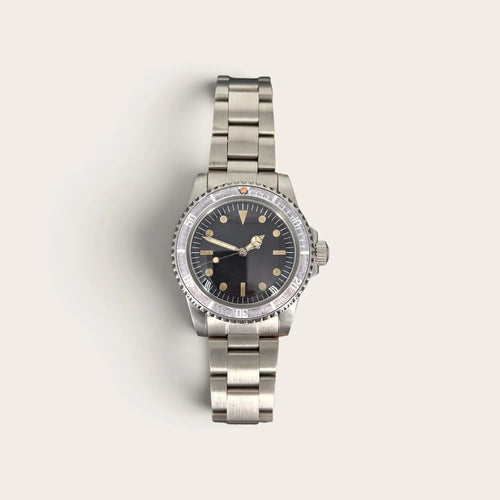 Front view of the NH35 dive watch with faded ghost bezel and aged black dial