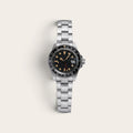 Vintage-style black-bezel GMT watch with a weathered steel case and bracelet